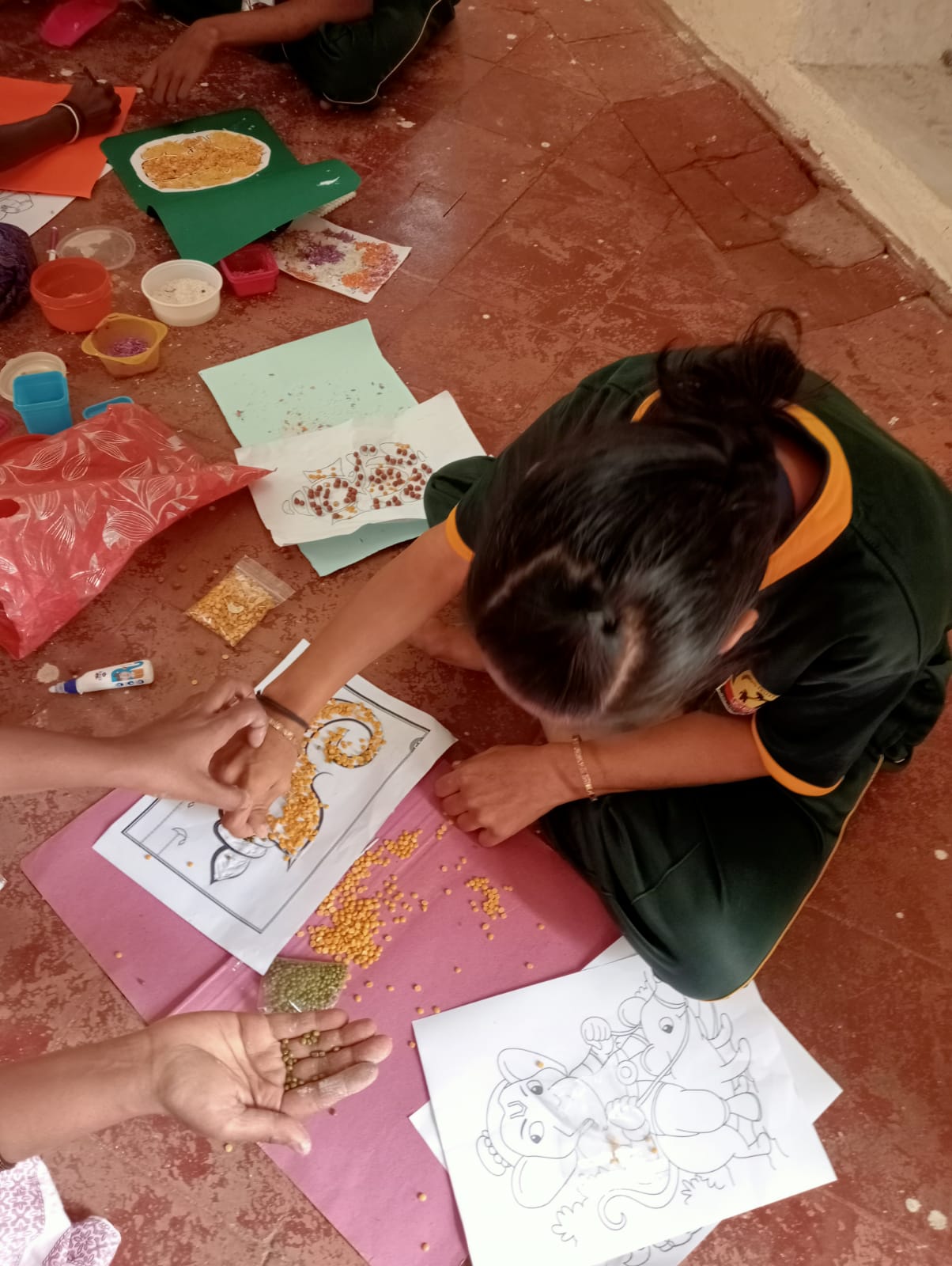 Student creating seed art